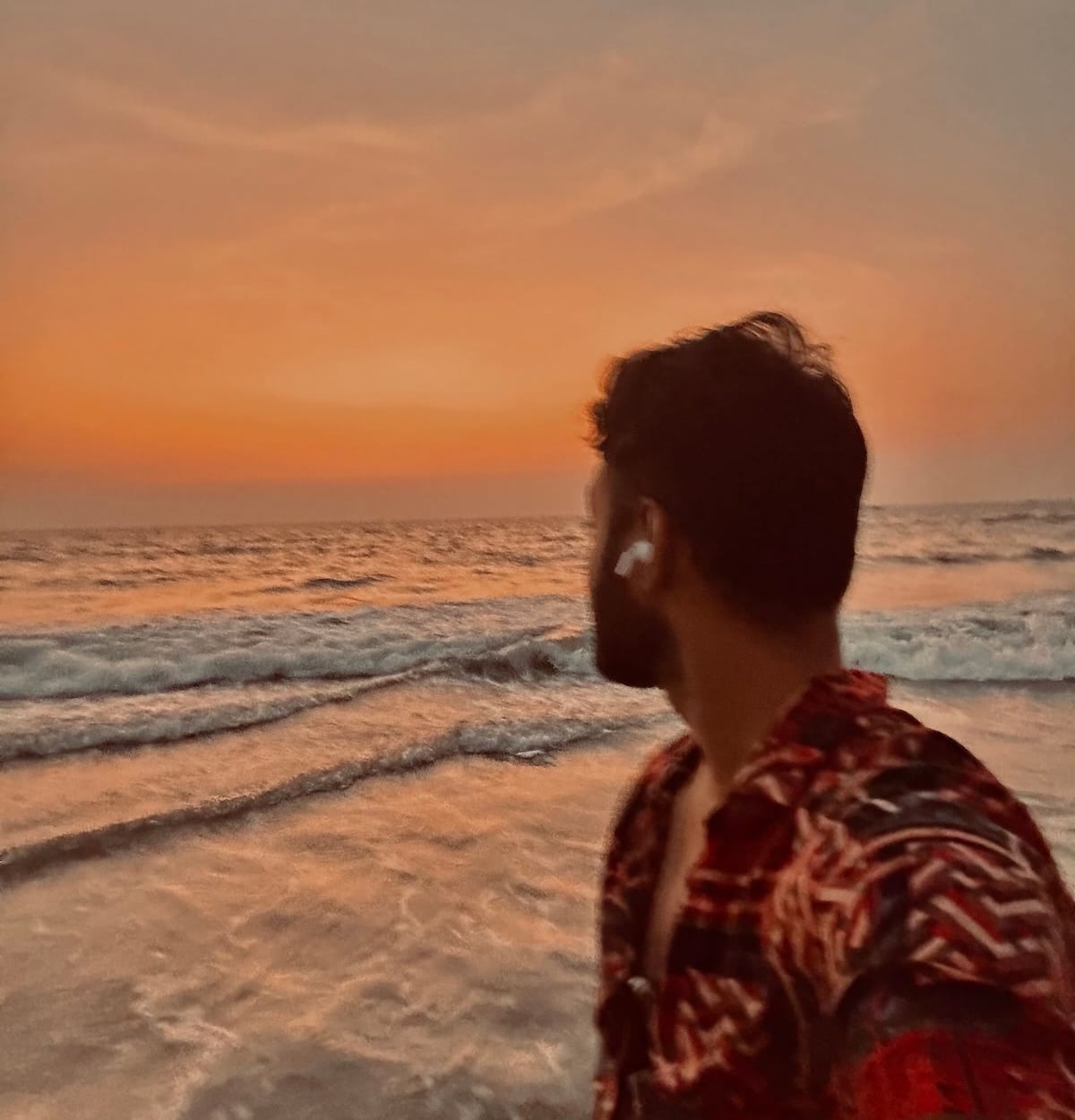 Rishi on a beach in Goa doing what he loves, watching sunset